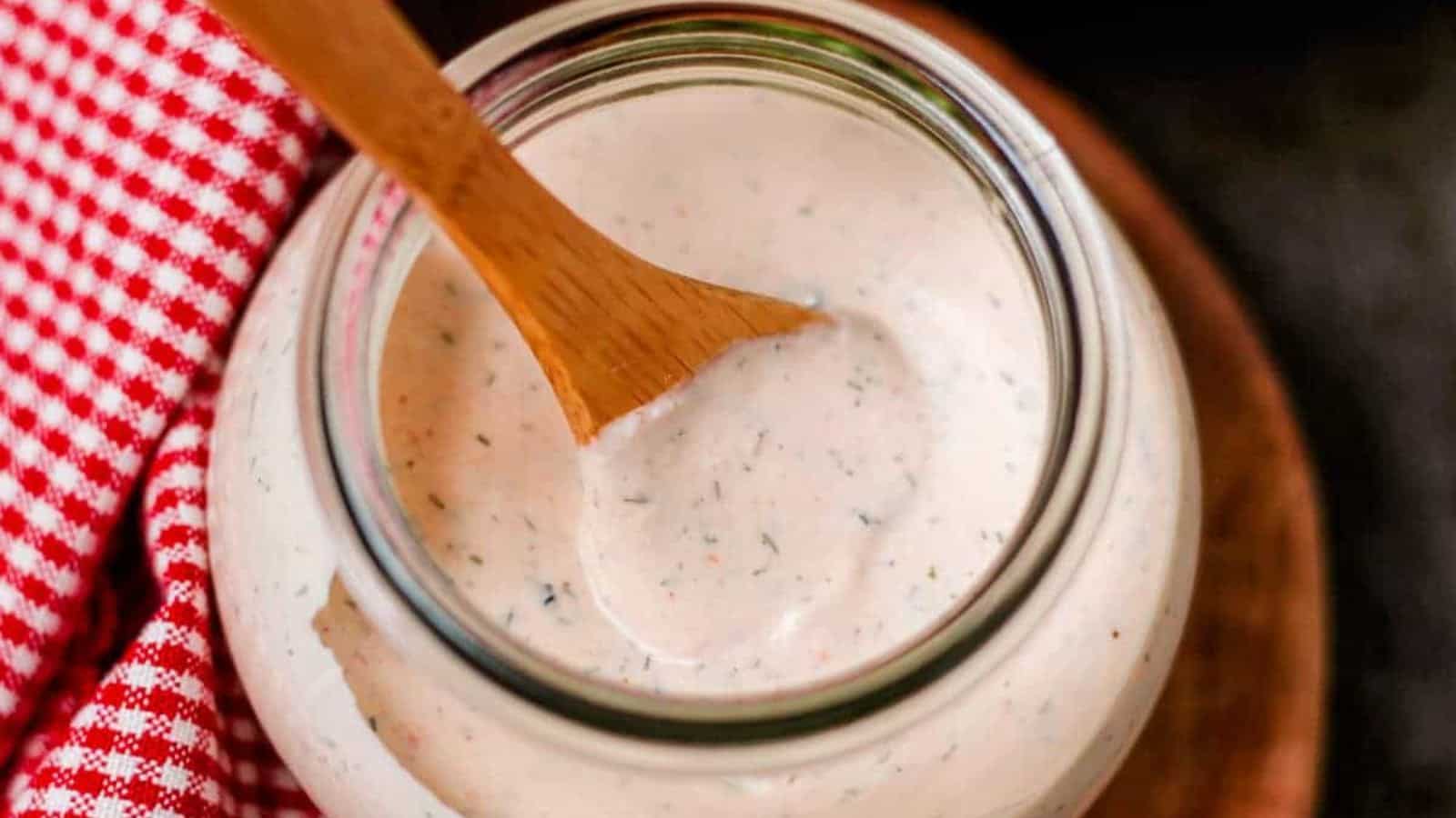 A jar of homemade spicy ranch dressing.