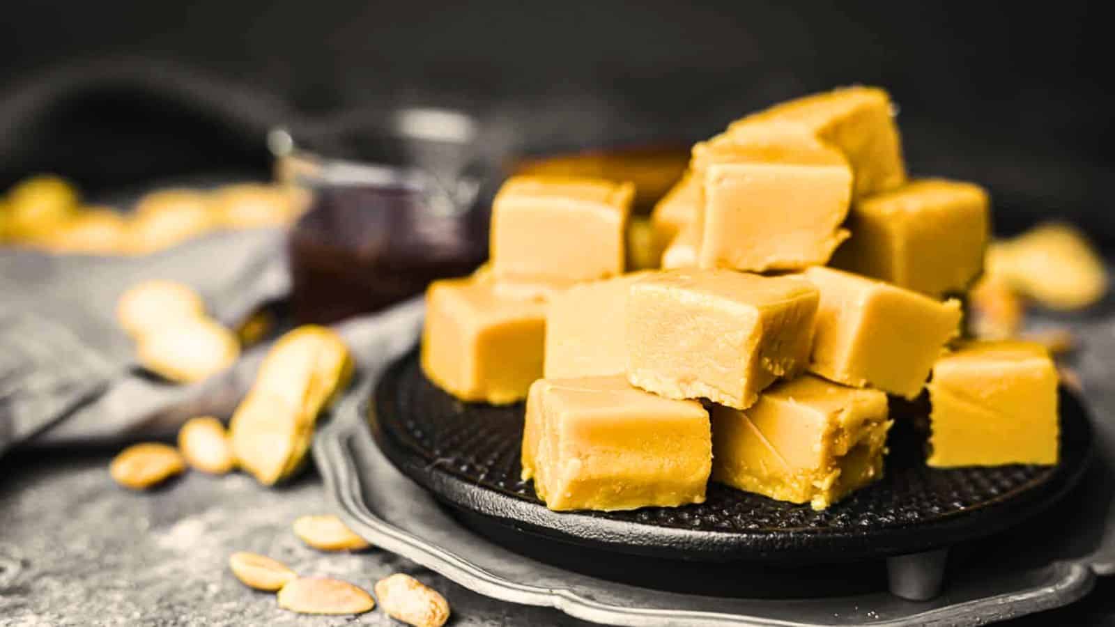 Peanut Butter Fudge on a black plate.