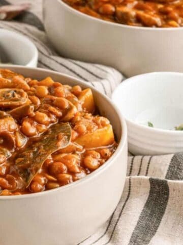 Close-up image of vegan mushroom lentil stew in a bowl.