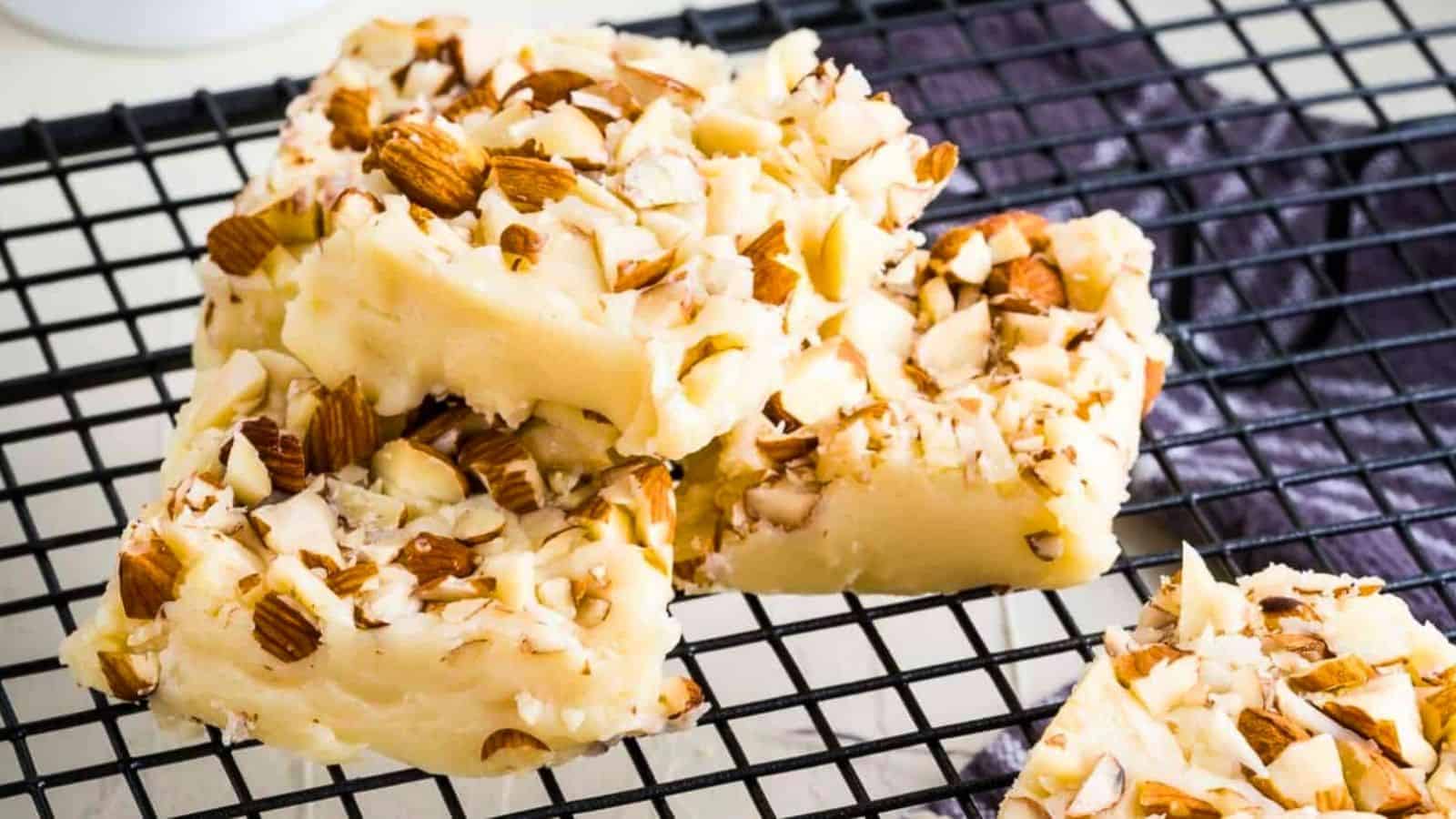 Close-up image of white chocolate fudge on a rack.