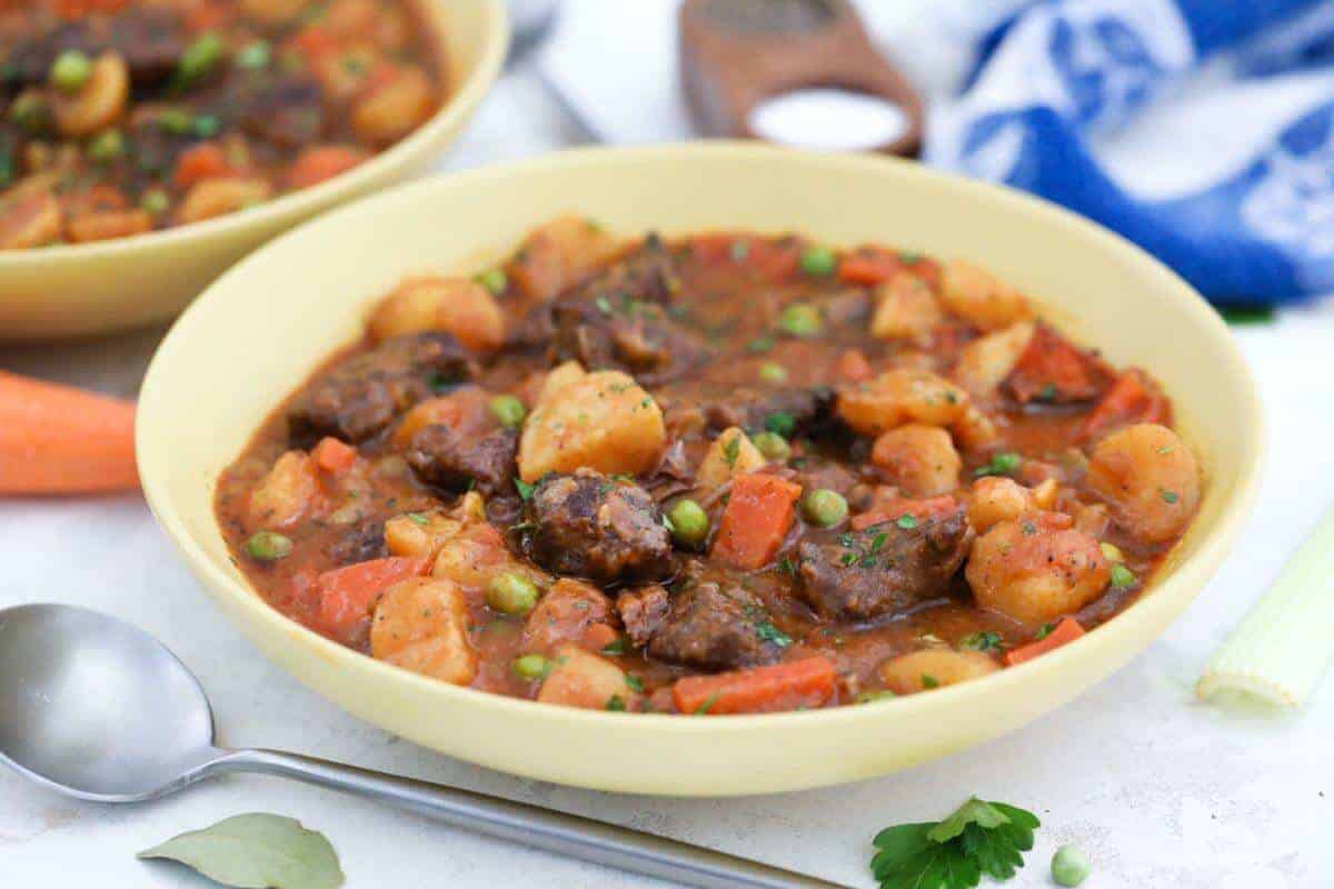 Beef stew in yellow bowls.