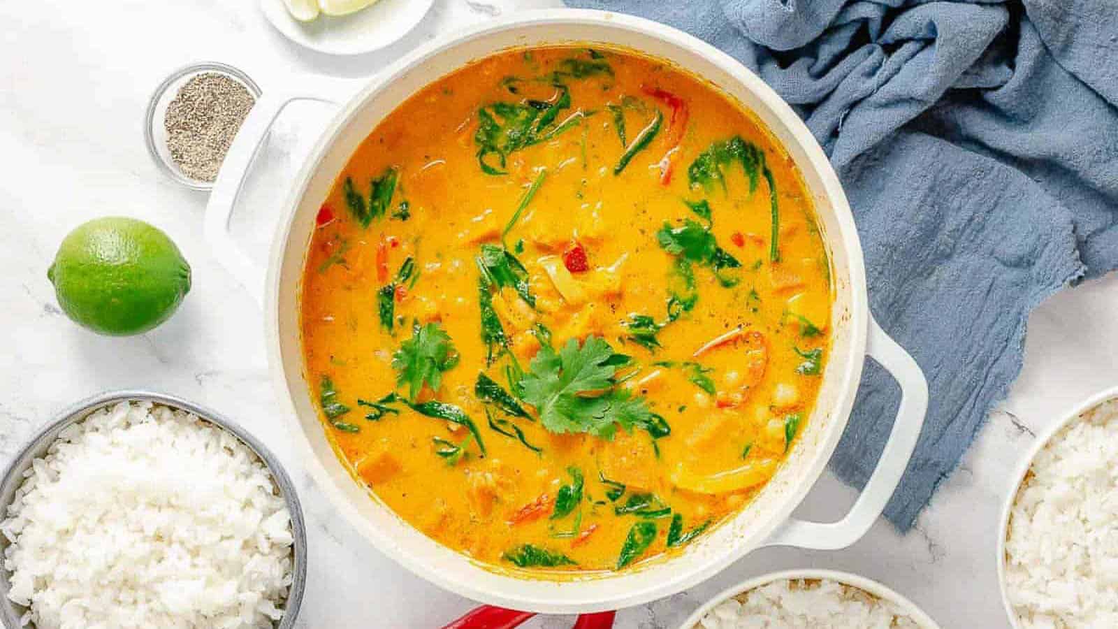 Overhead shot of a white pot with Thai pumpkin curry.