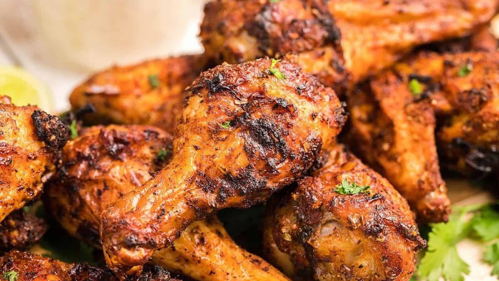 Close-up image of air fryer chipotle chicken wings with buttermilk firecracker ranch.