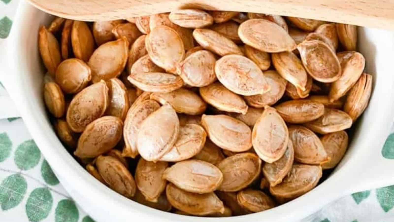 Close-up image of air fryer roasted pumpkin seeds in a bowl.