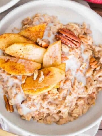 Overhead image of apple cinnamon oatmeal in a bowl.