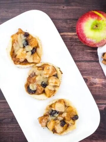 A plate of three Apple-Cranberry Puff Pastry Tarts.