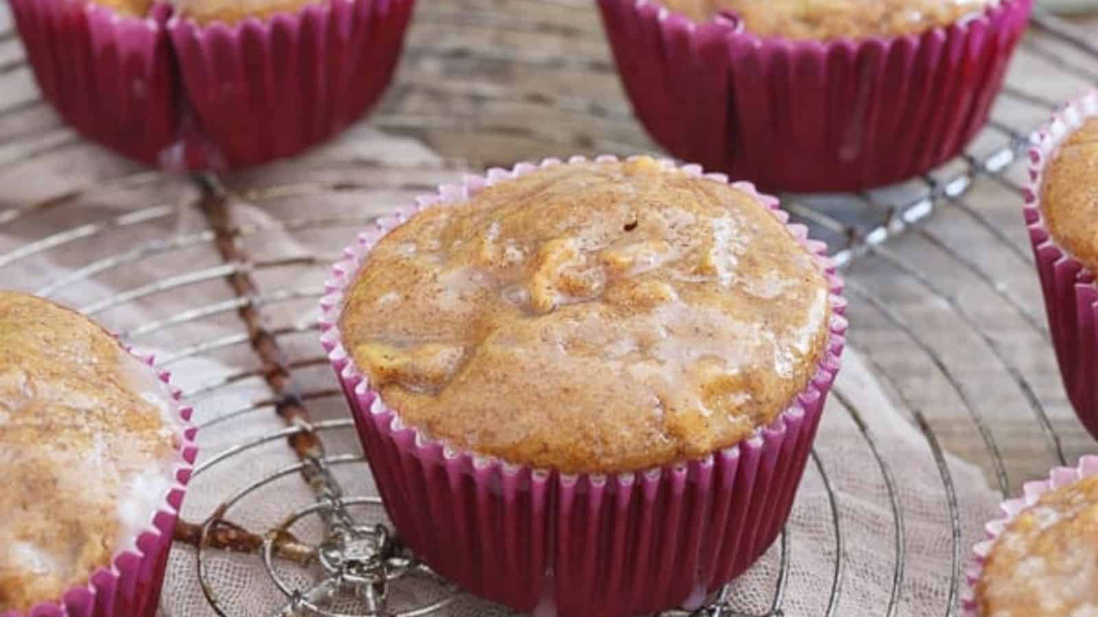 Apple fritter muffins on a cooling rack.