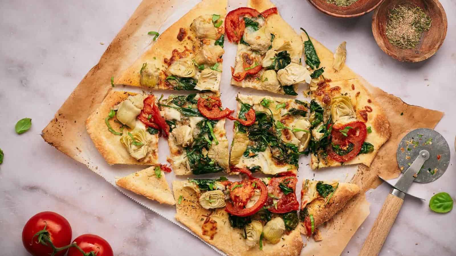 Artichoke Pizza on a wooden board.