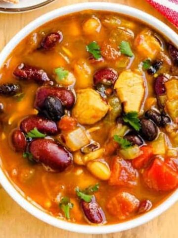 Overhead image of a bowl of chicken bean soup.