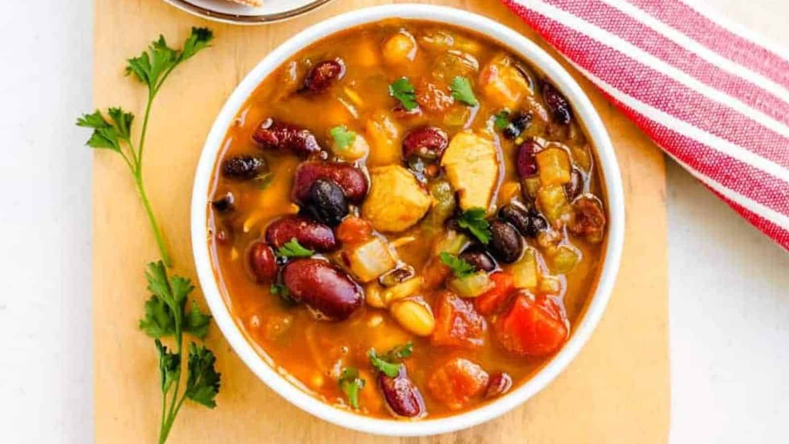 Overhead image of a bowl of chicken bean soup.