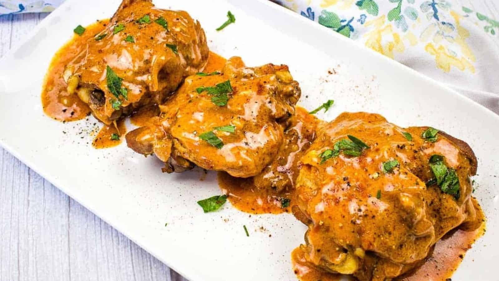 Chicken Paprikash on a platter with gravy.