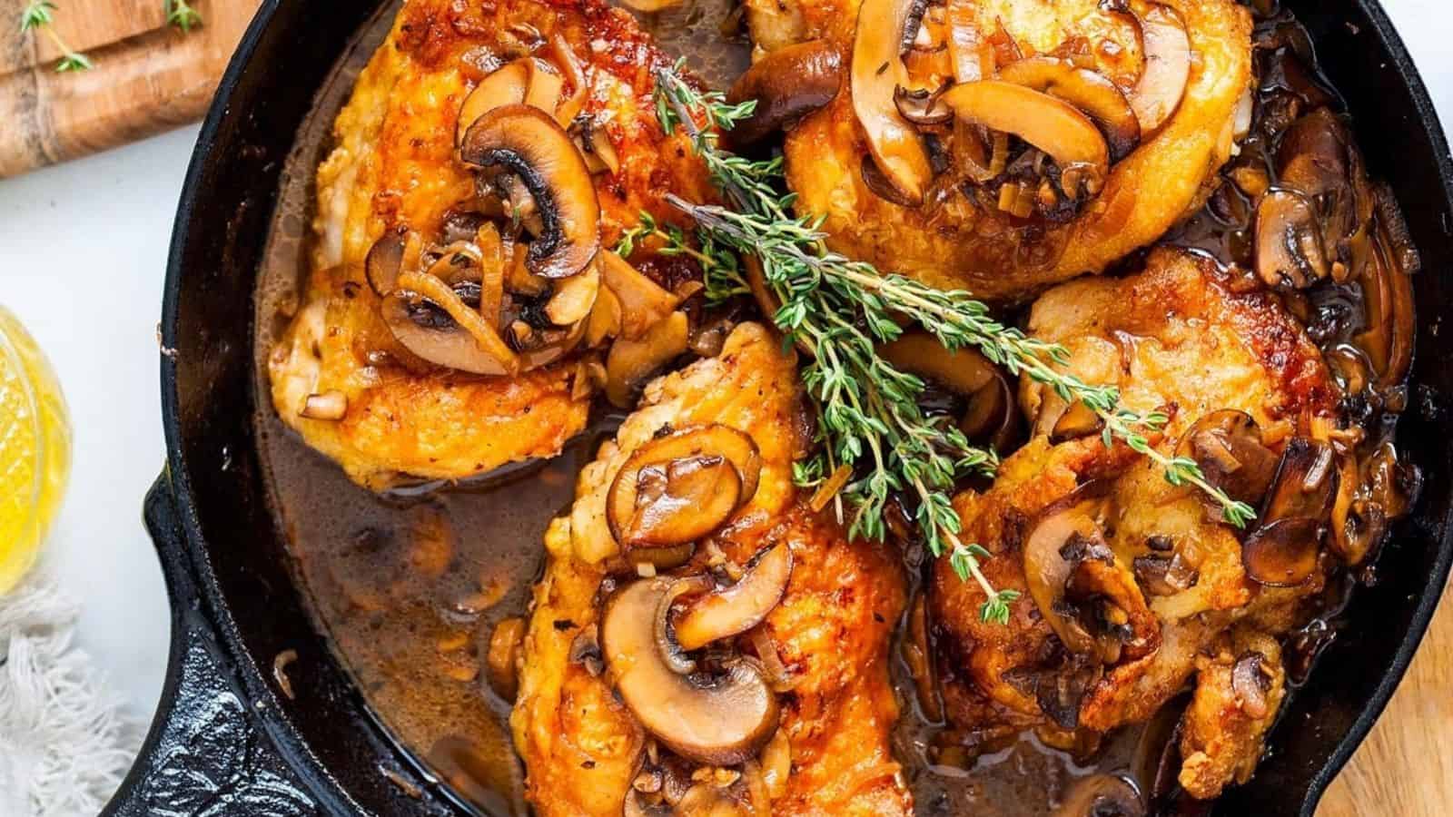 Overhead image of chicken thigh marsala in a pan.