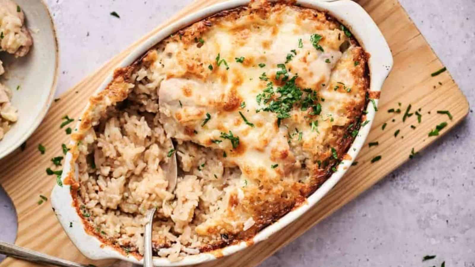 Overhead image of chicken and rice casserole on top of a wooden board.