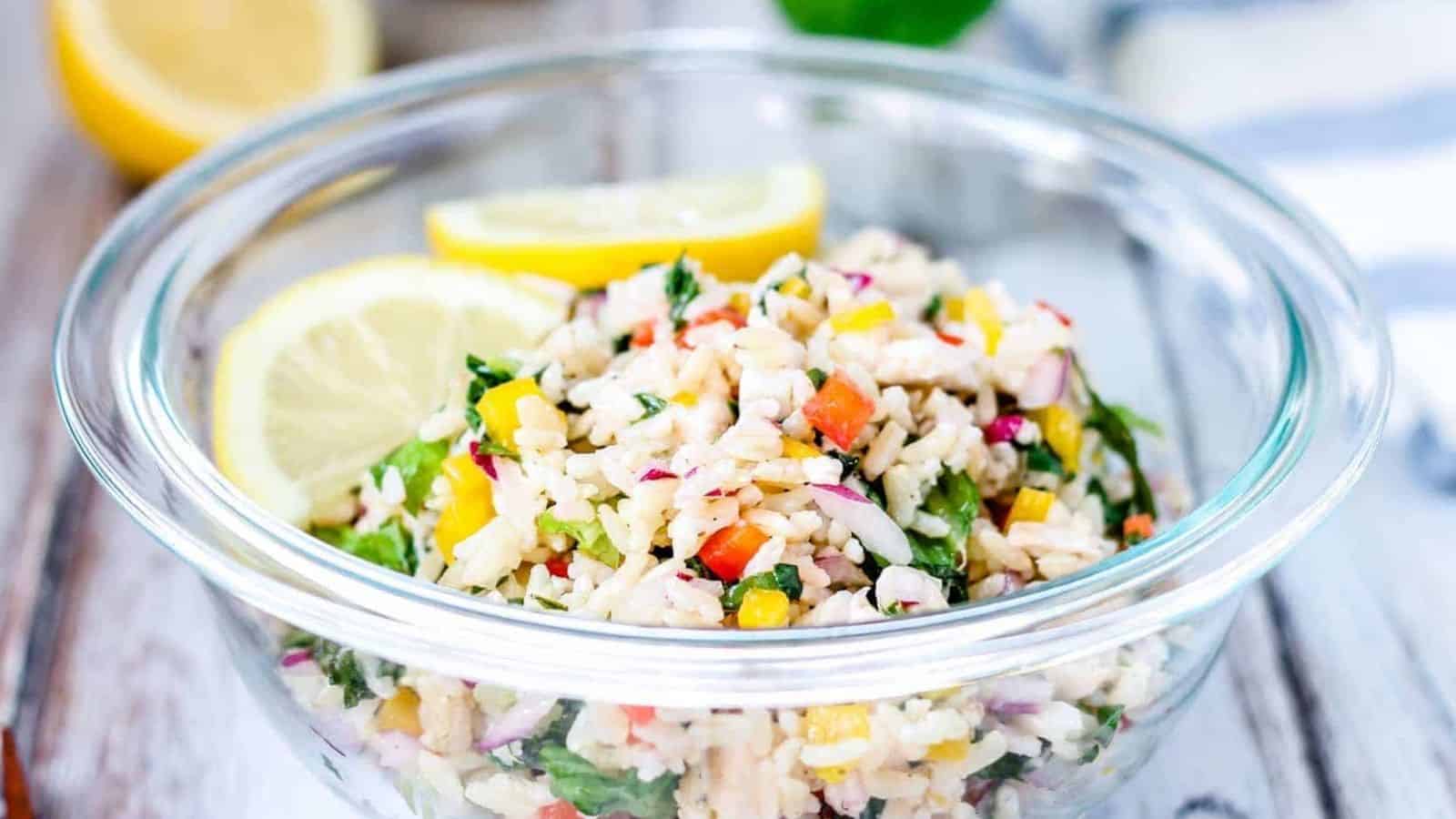 Chicken and rice salad in a glass bowl.