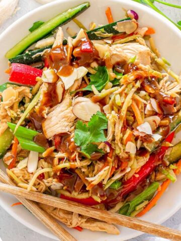 A plate of Chinese Chicken Salad with chopsticks.