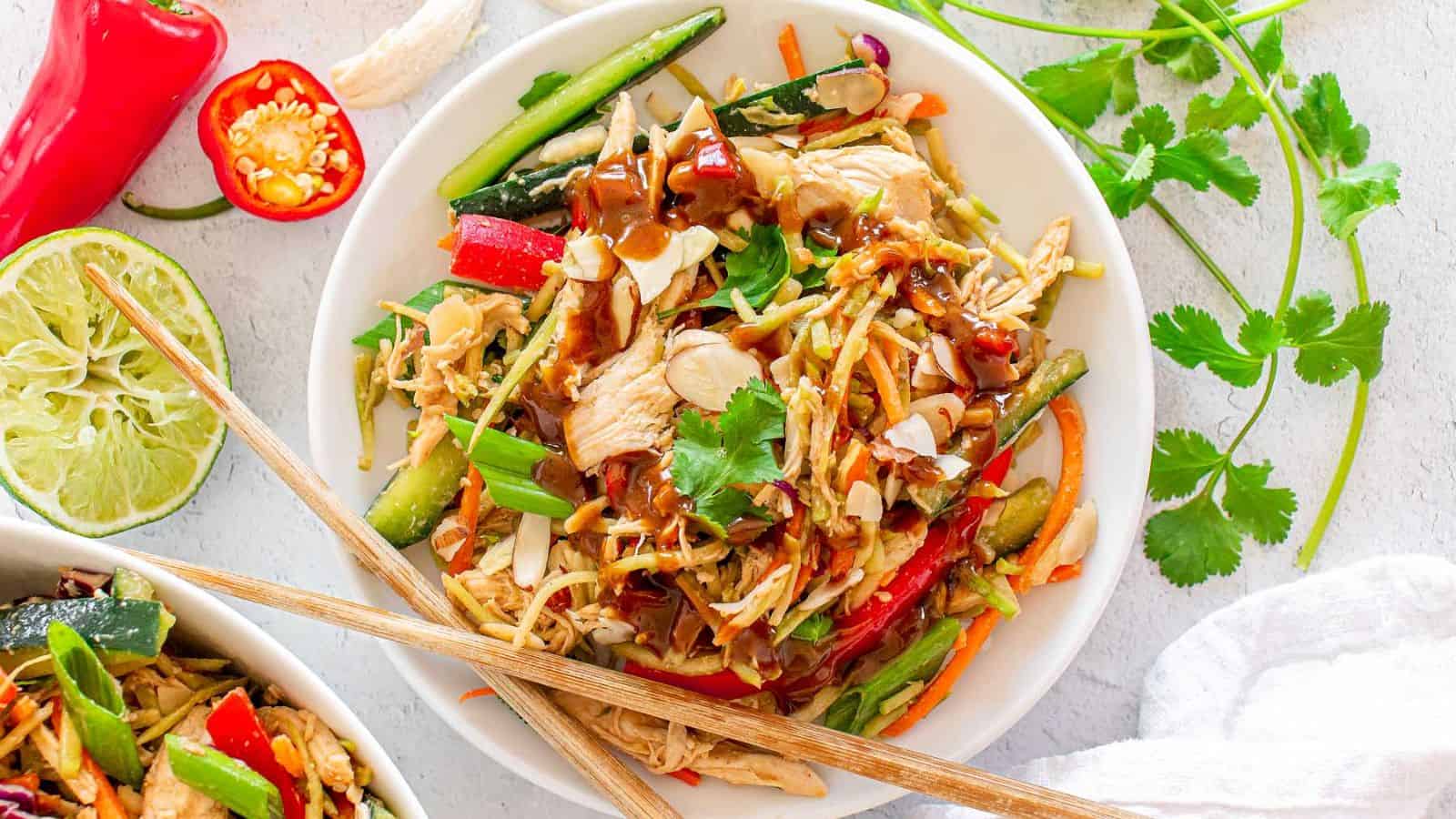 A plate of Chinese Chicken Salad with chopsticks.