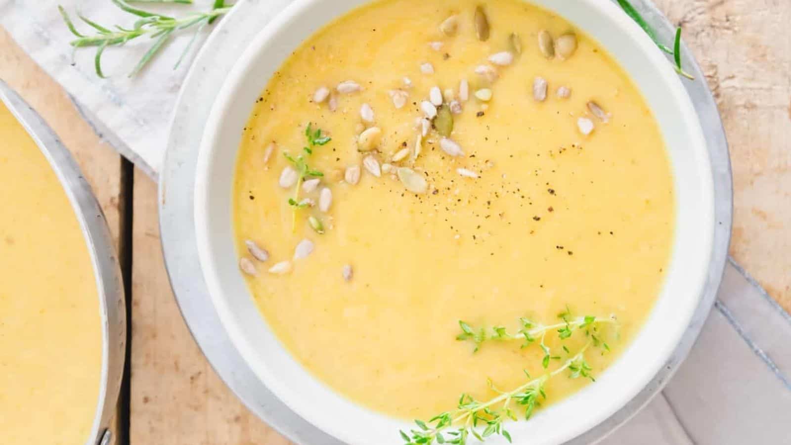 Overhead image of creamy root vegetable soup in a bowl.