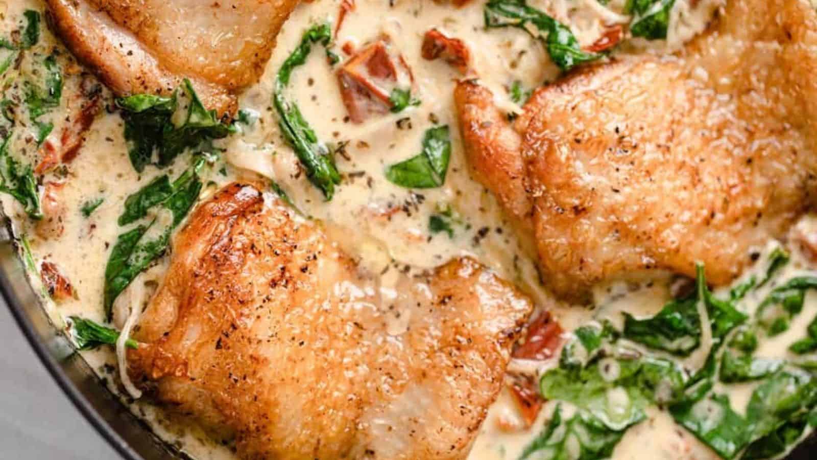 Creamy Tuscan chicken in a skillet.