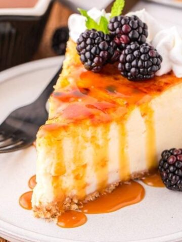 Creme brulee cheesecake with a fork on a plate.
