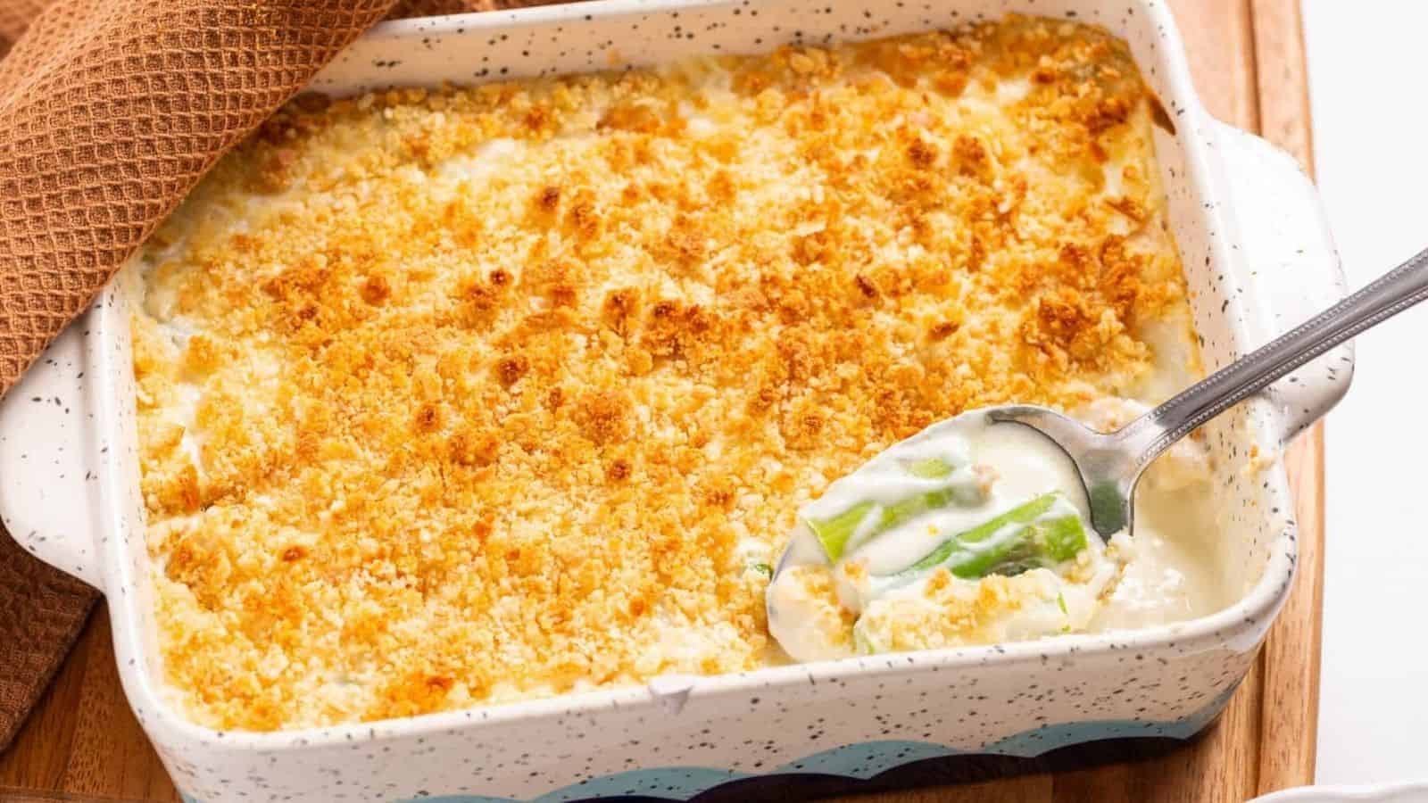 A close up view of a cooked asparagus casserole in a baking dish.