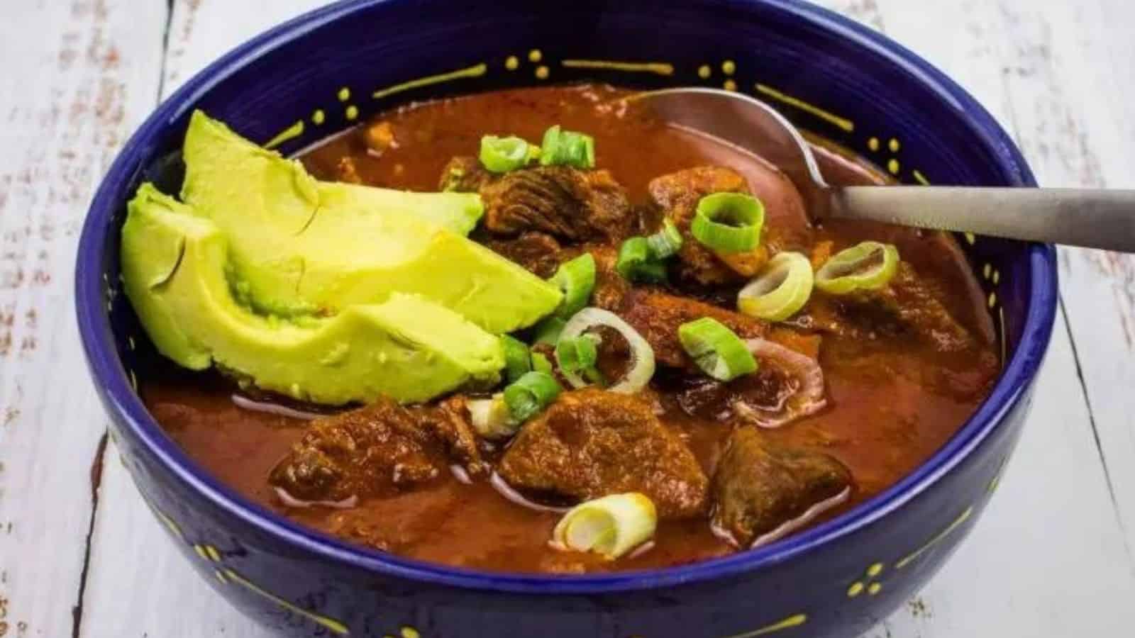 Close-up of easy chili with a spoon in a blue bowl.