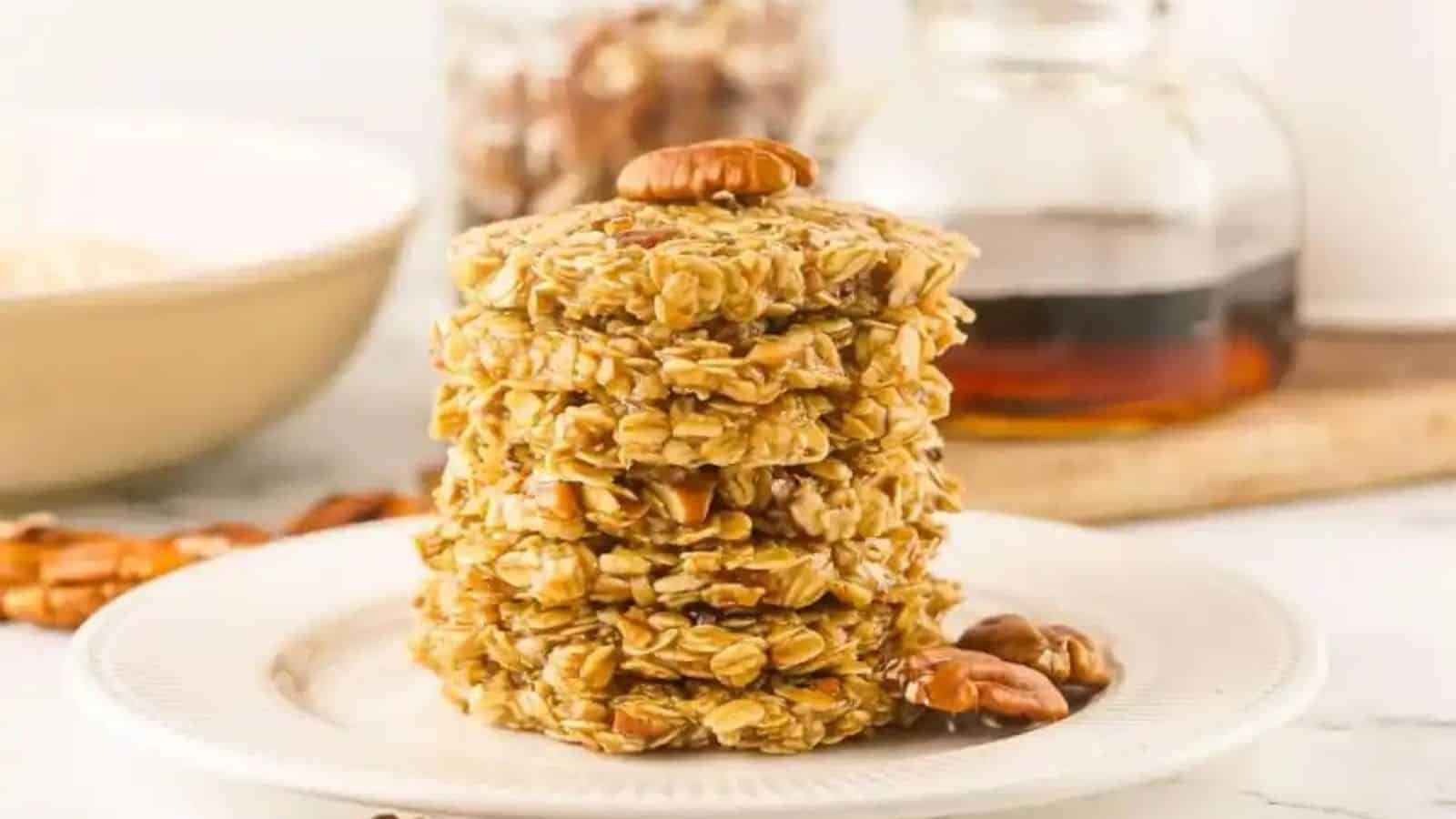 A stack of maple pecan cookies on a white plate.