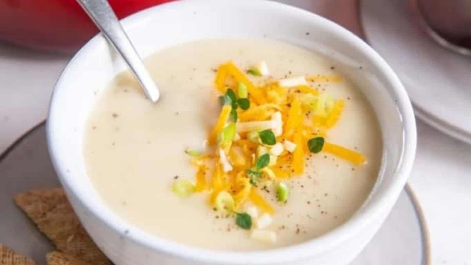 Close-up image of easy potato soup with a spoon in a bowl.