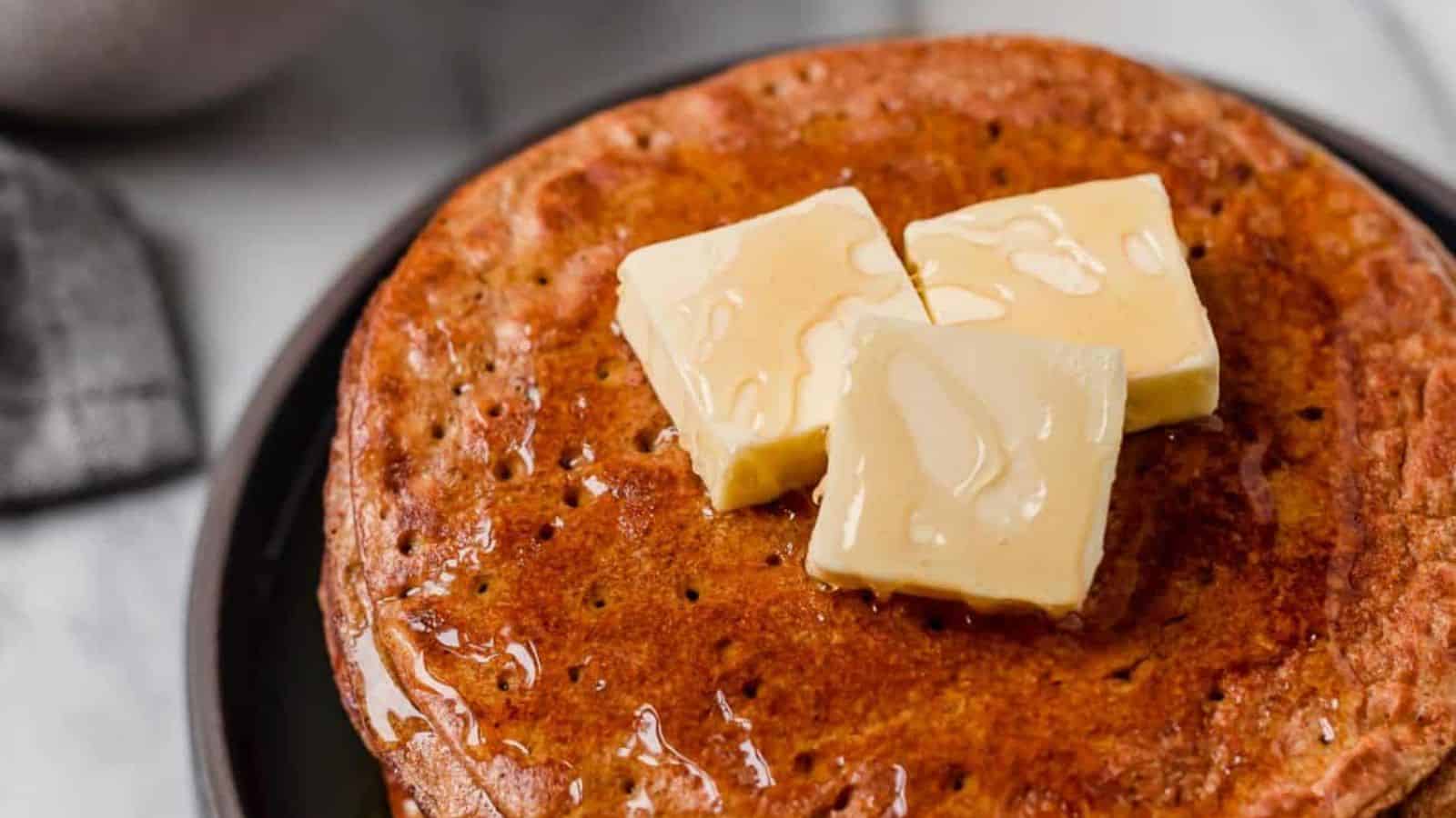 A close-up image of Flourless Pumpkin Spice Pancakes.