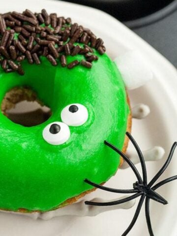 Frankenstein Apple Cider Halloween Donut on a plate.