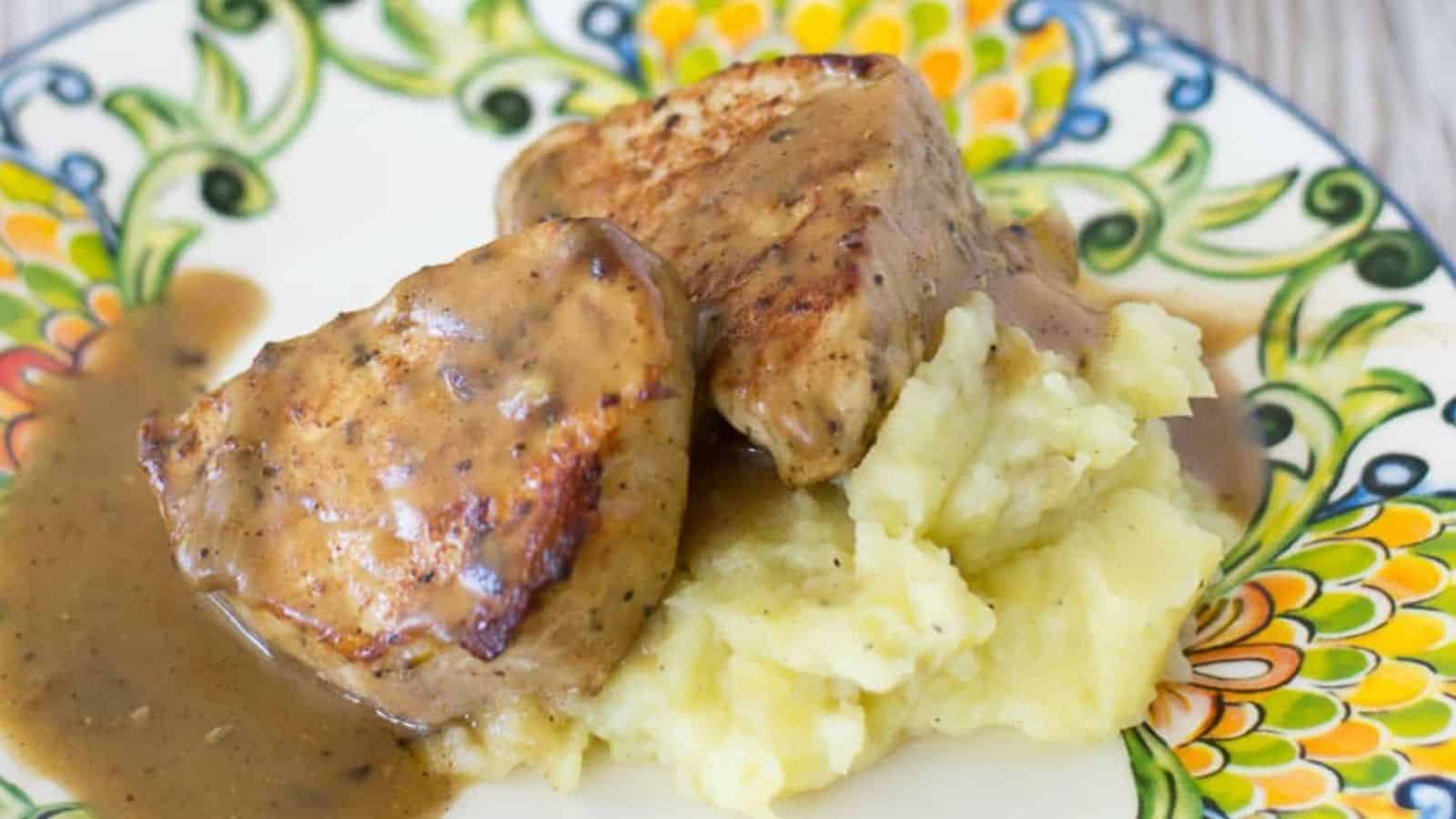 Garlic herb pork and potatoes on a plate.