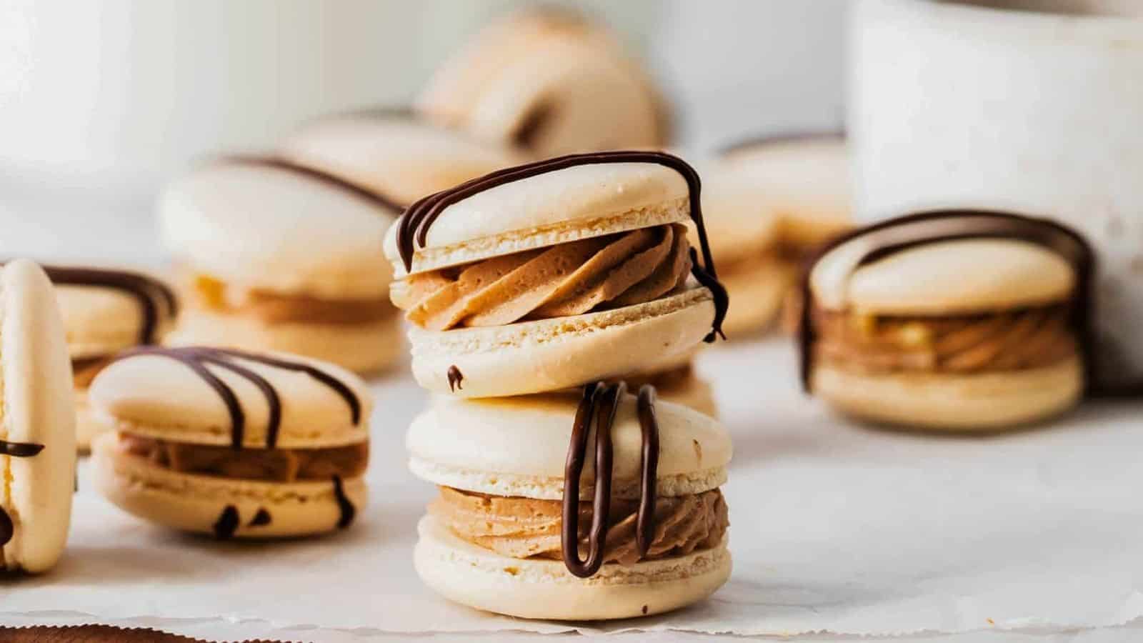 German chocolate macarons with chocolate ganache drizzle.