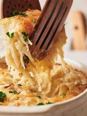 Hashbrown casserole being served.