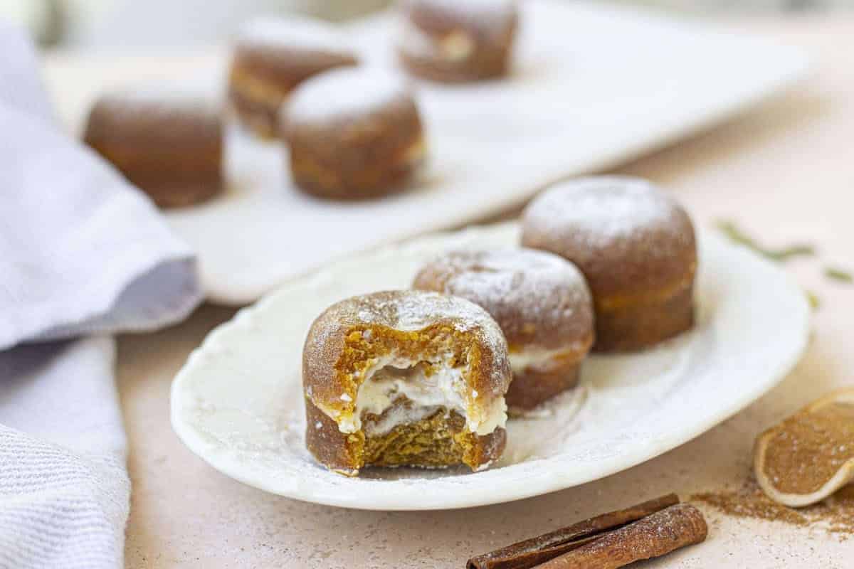 A plate with a couple of instant pot pumpkin bites on it.