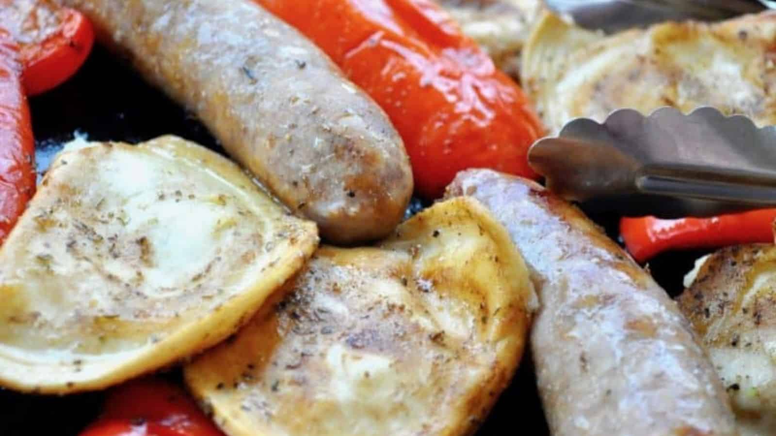 Close-up image of italian sausge pierogies sheet pan dinner.