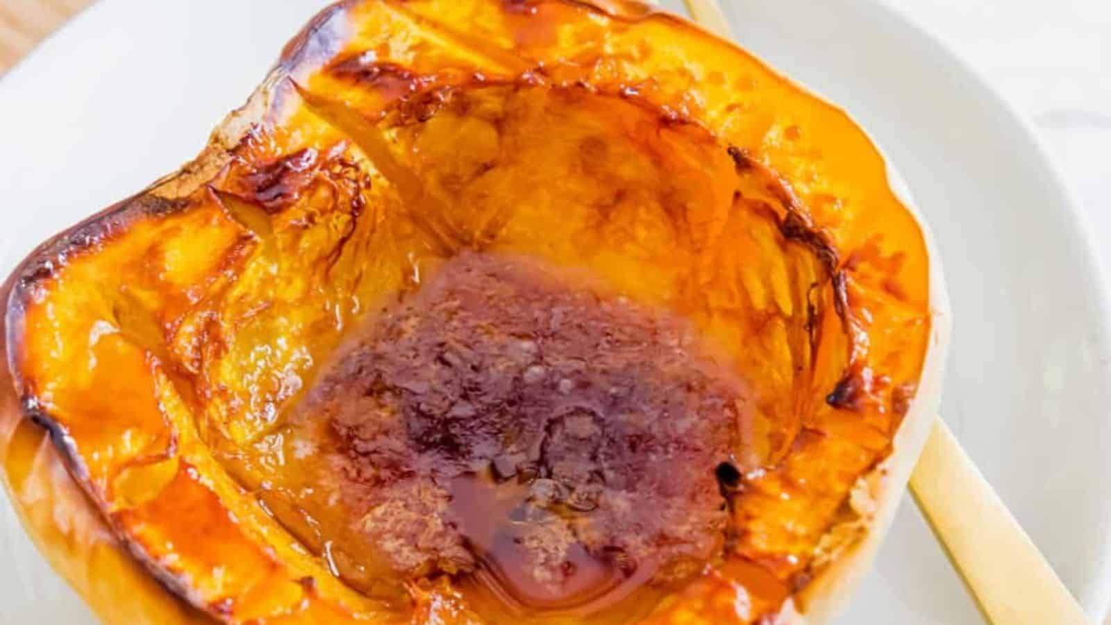 Close-up image of maple baked white acorn squash.