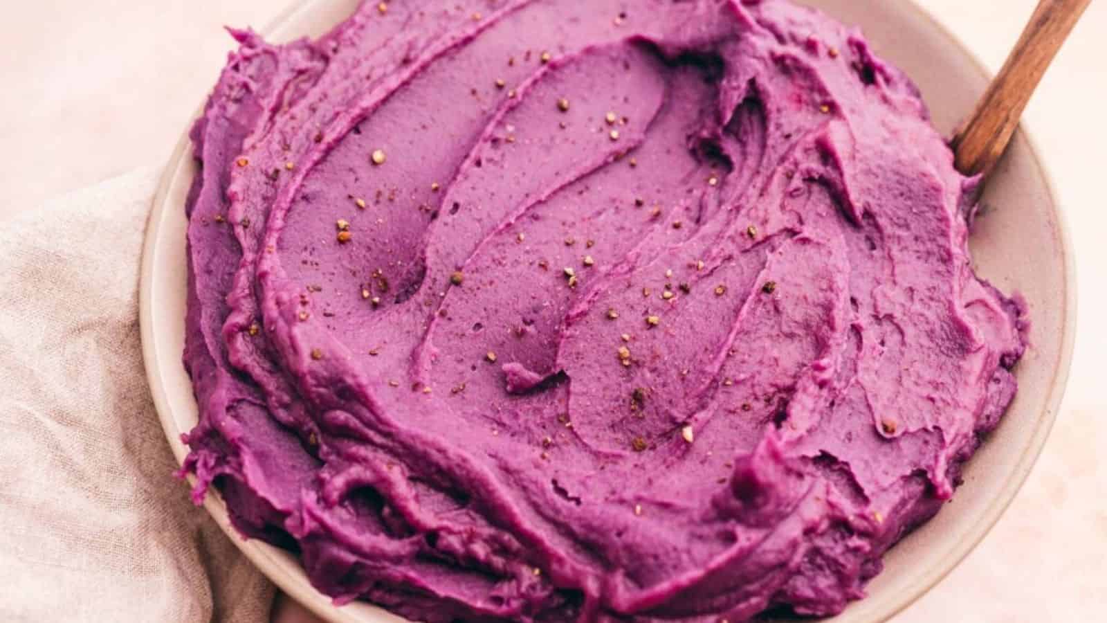 Mashed purple sweet potatoes in a bowl.