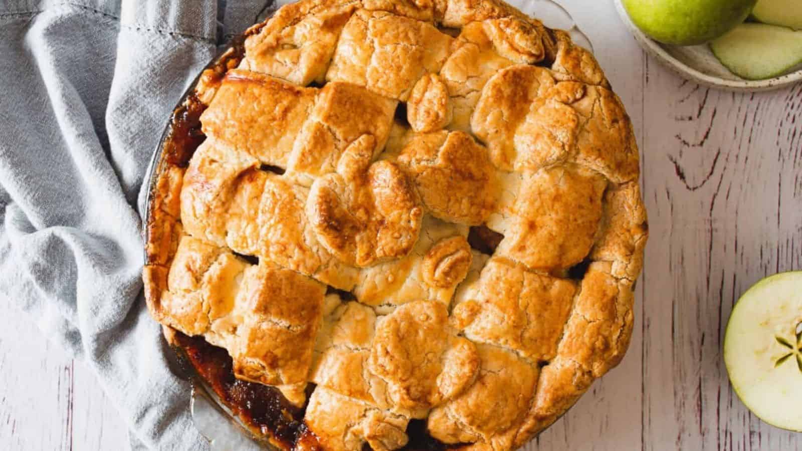 Overhead view of apple pie with apples.