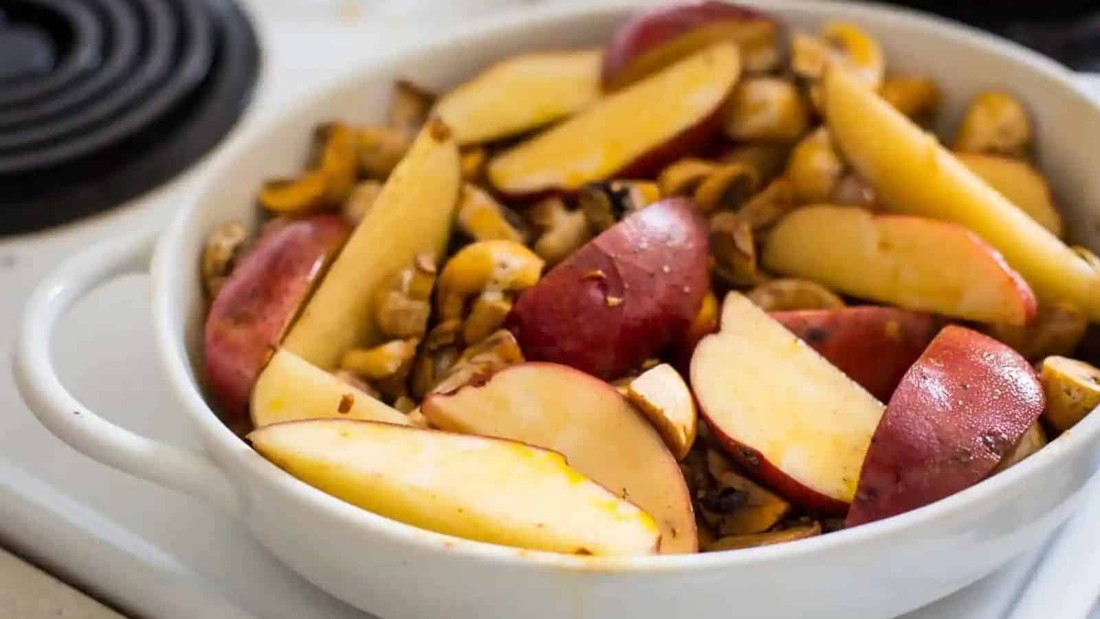 Close-up image of paprika oil roasted potatoes and mushrooms.