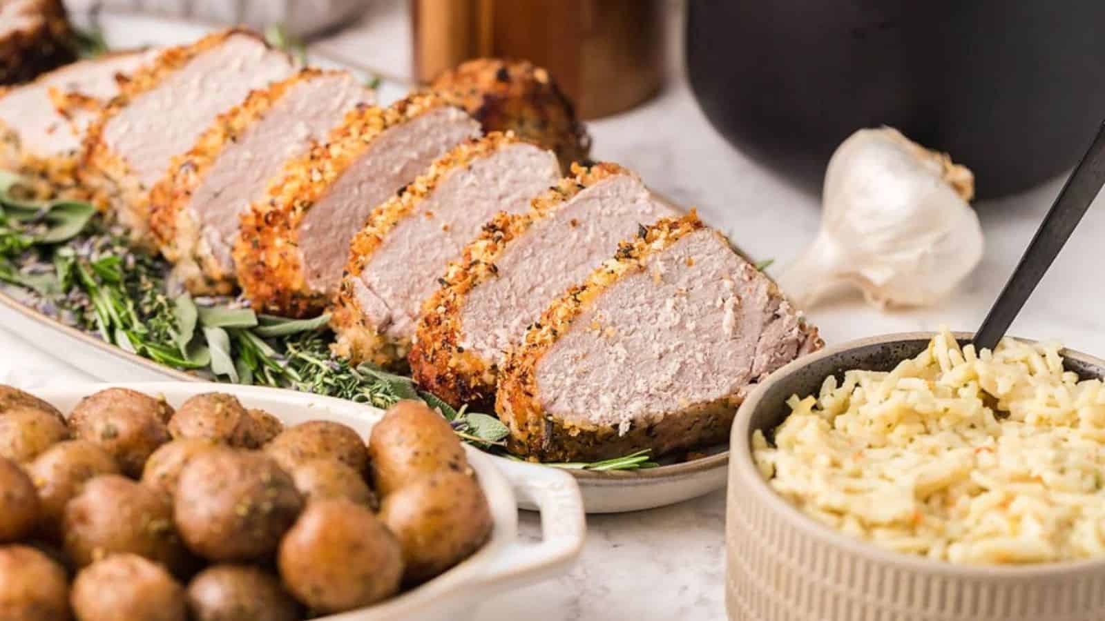 A plate of sliced Parmesan Herb Crusted Pork Tenderloin.