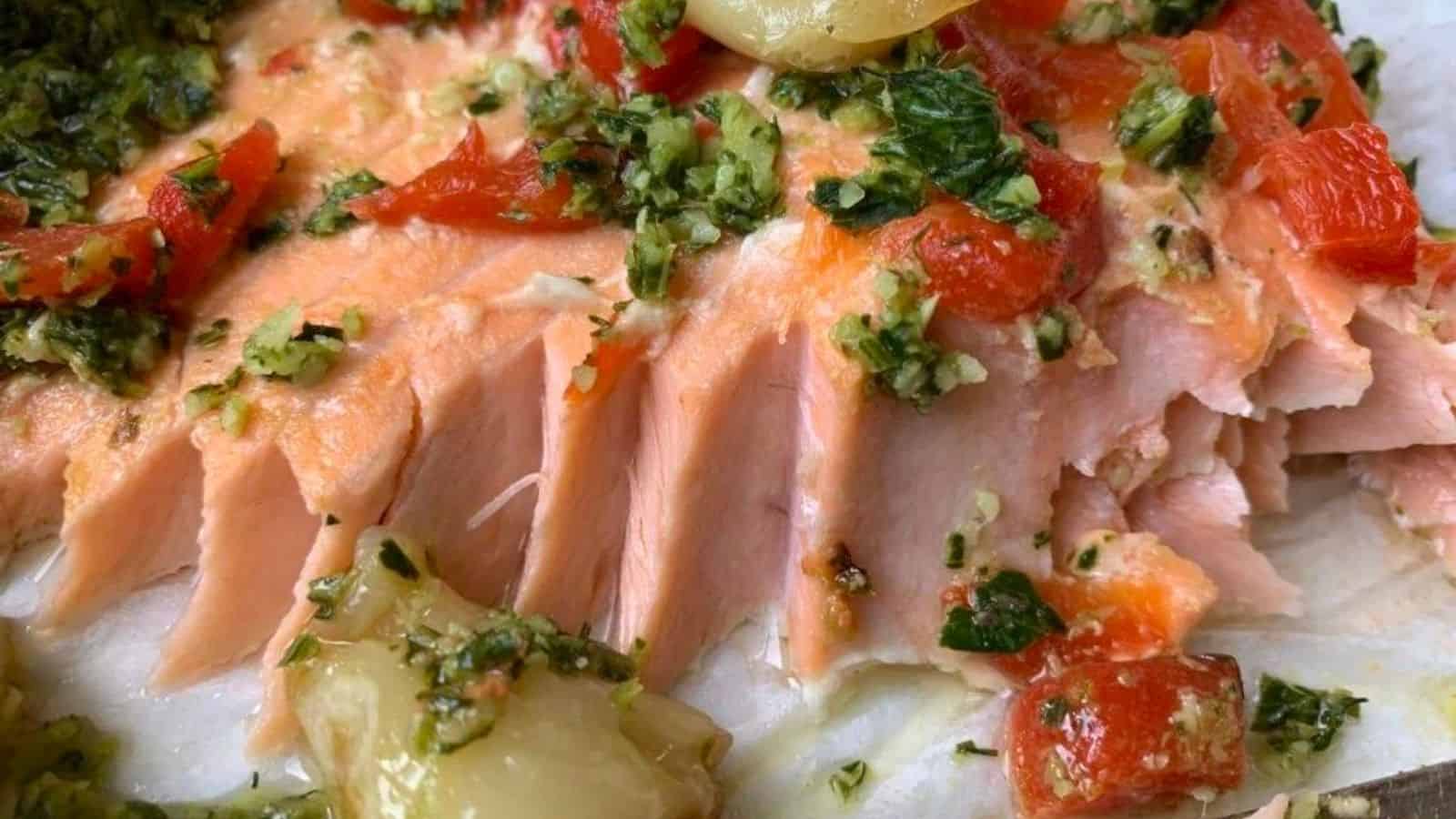 Salmon roasted with herbs, onions, and garlic.