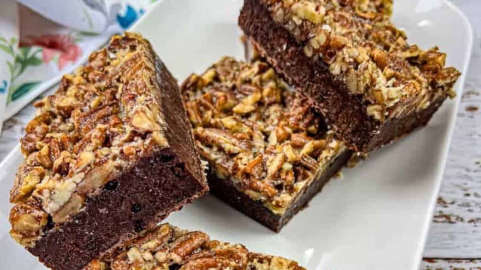 Close-up image of pecan pie brownies on a plate.