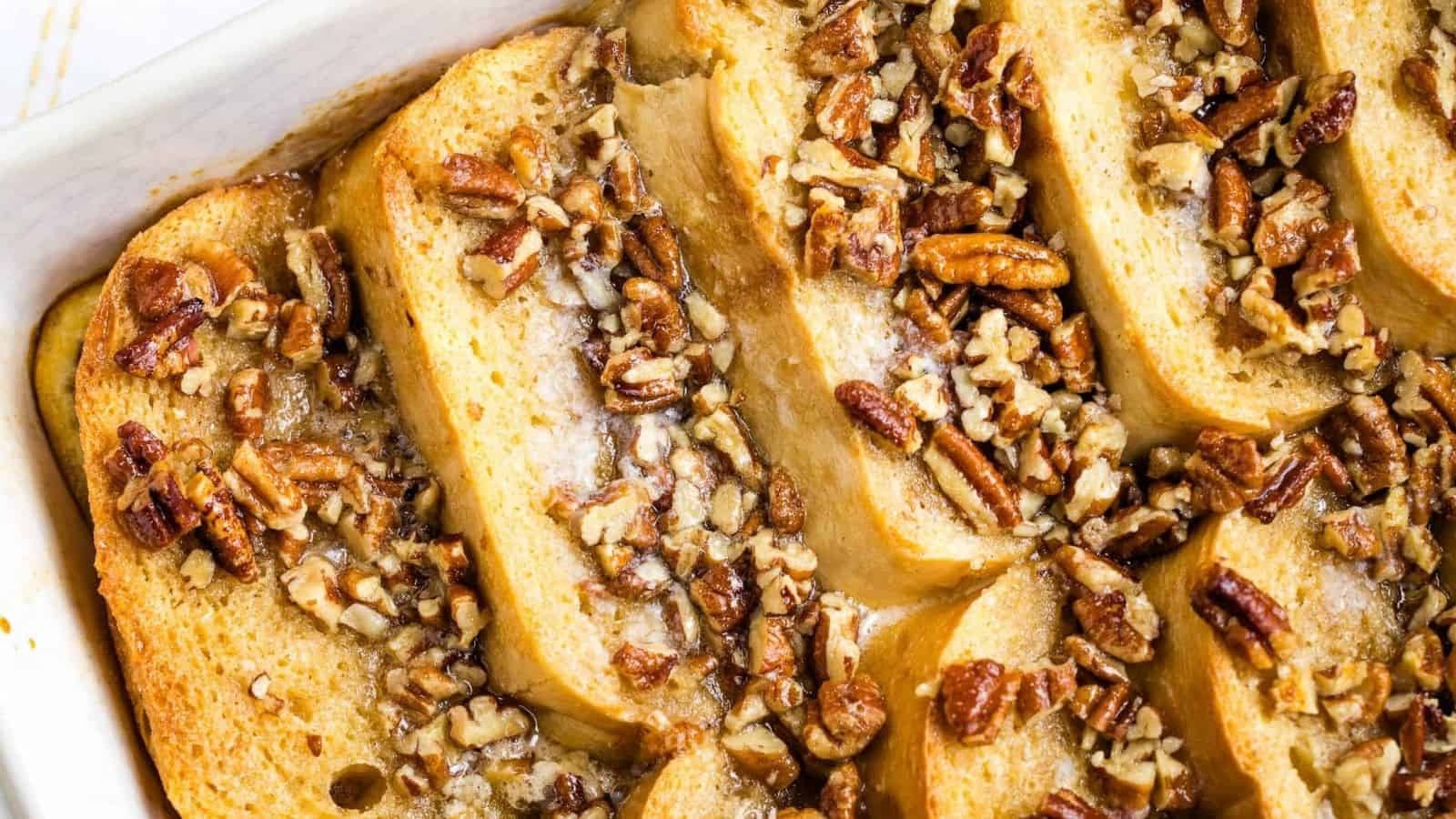 French toast casserole with pecans in a baking dish.