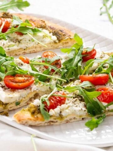 An image of slices of flatbread on a serving plate.