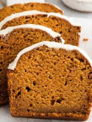 Slices of Pumpkin Bread With Cream Cheese Frosting.