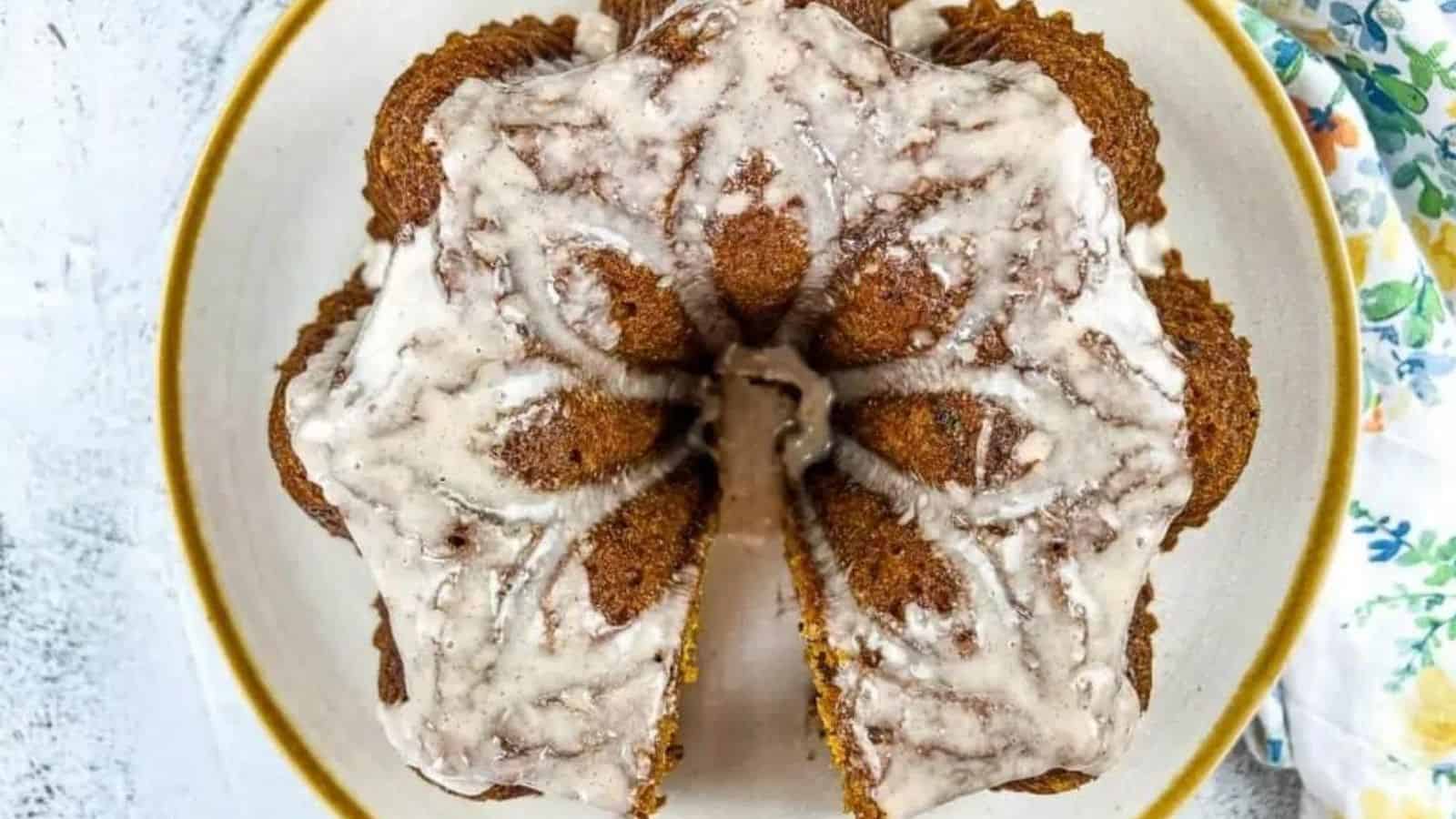 Top view image of pumpkin chocolate cake missing a slice.