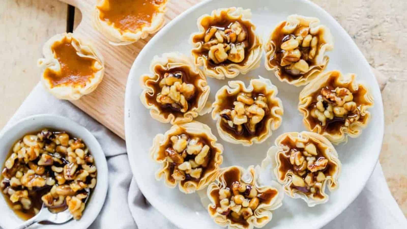 Overhead image of pumpkin pie bites on a white plate.