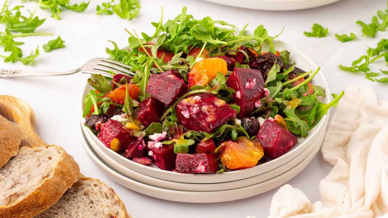 Roasted Beet Salad on a stack of plates.