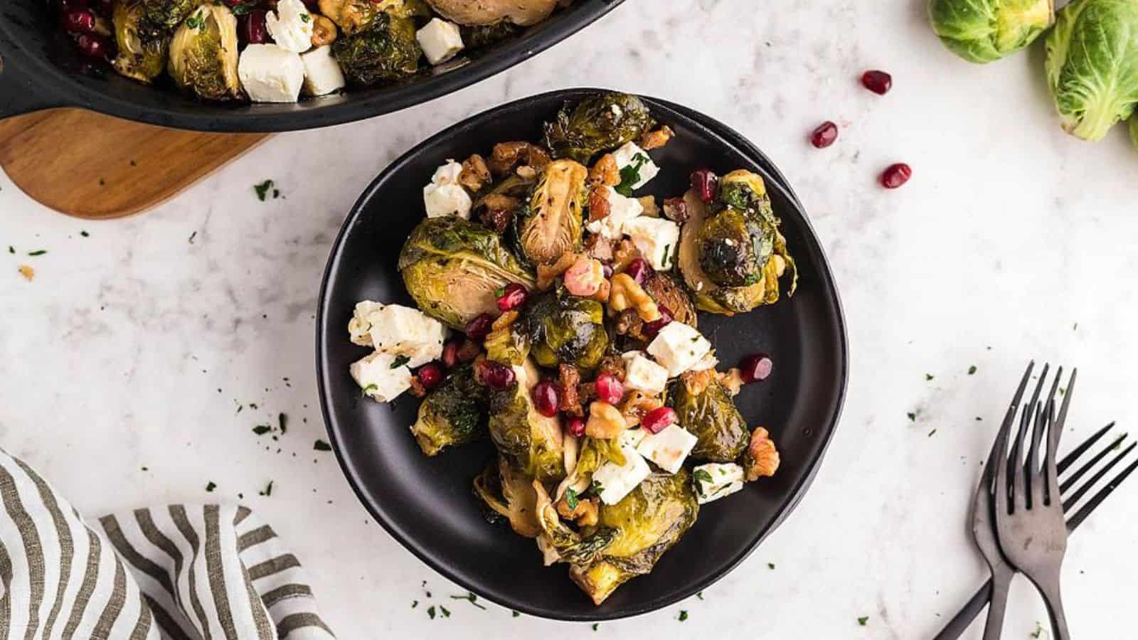 A plate of Roasted Brussels Sprout Pomegranate Pancetta Feta Casserole.