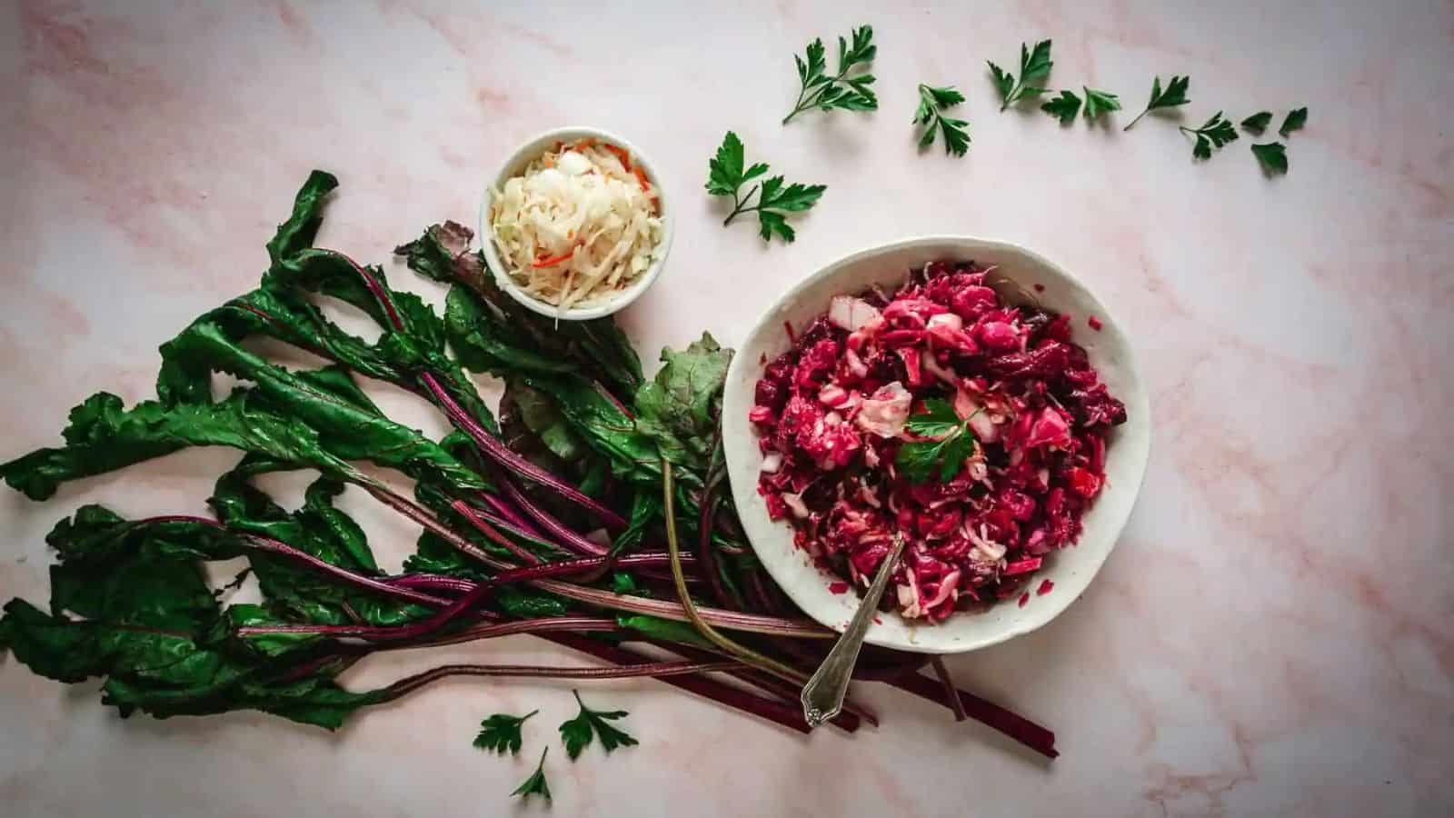 Overhead view of hand lifting a spoon of salad.