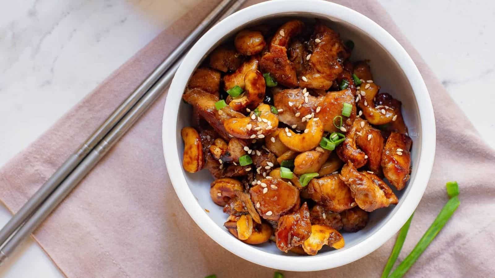 Sheet Pan Honey Soy Cashew Chicken with sesame seeds and chopsticks.